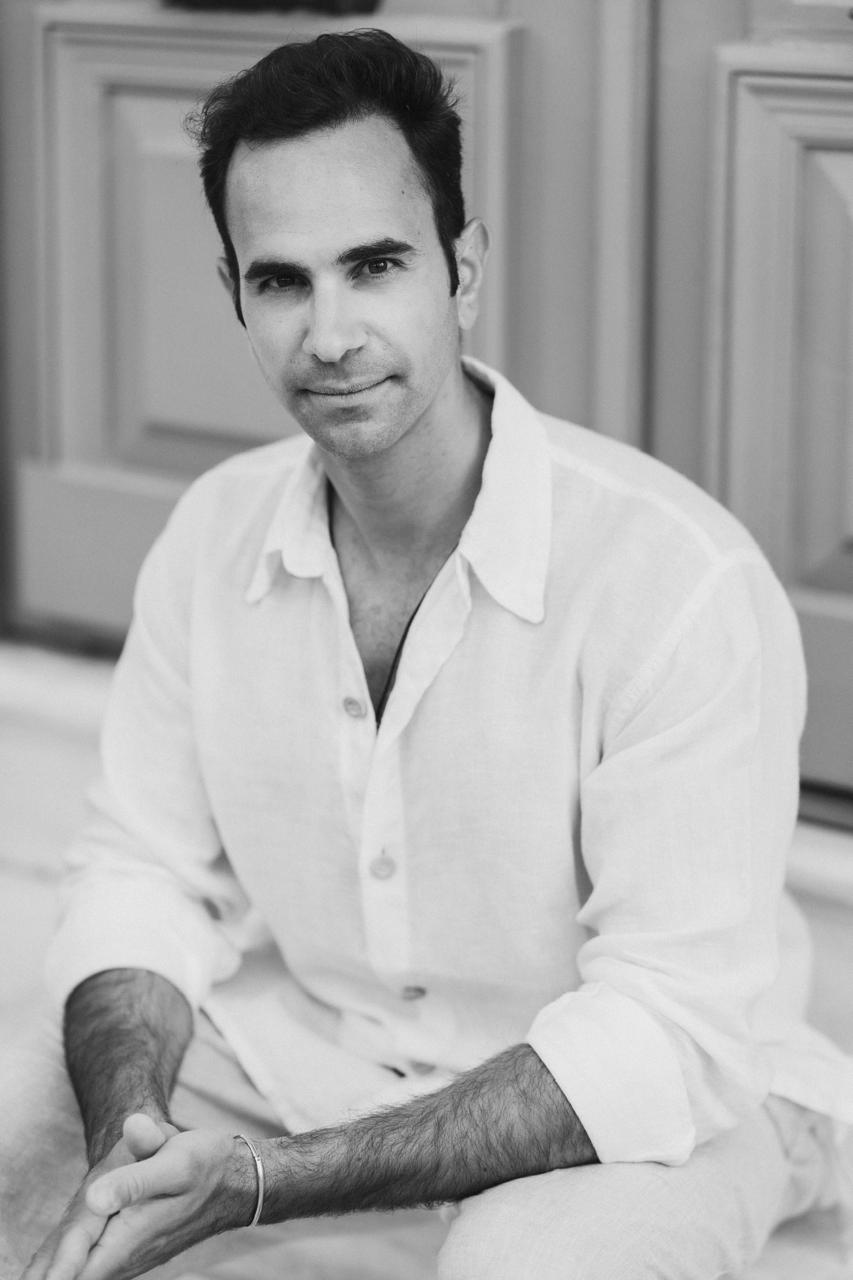 Kyriacos Papademetriou seated, black and white